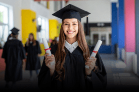 Postgraduate student holding degree and thesis documents