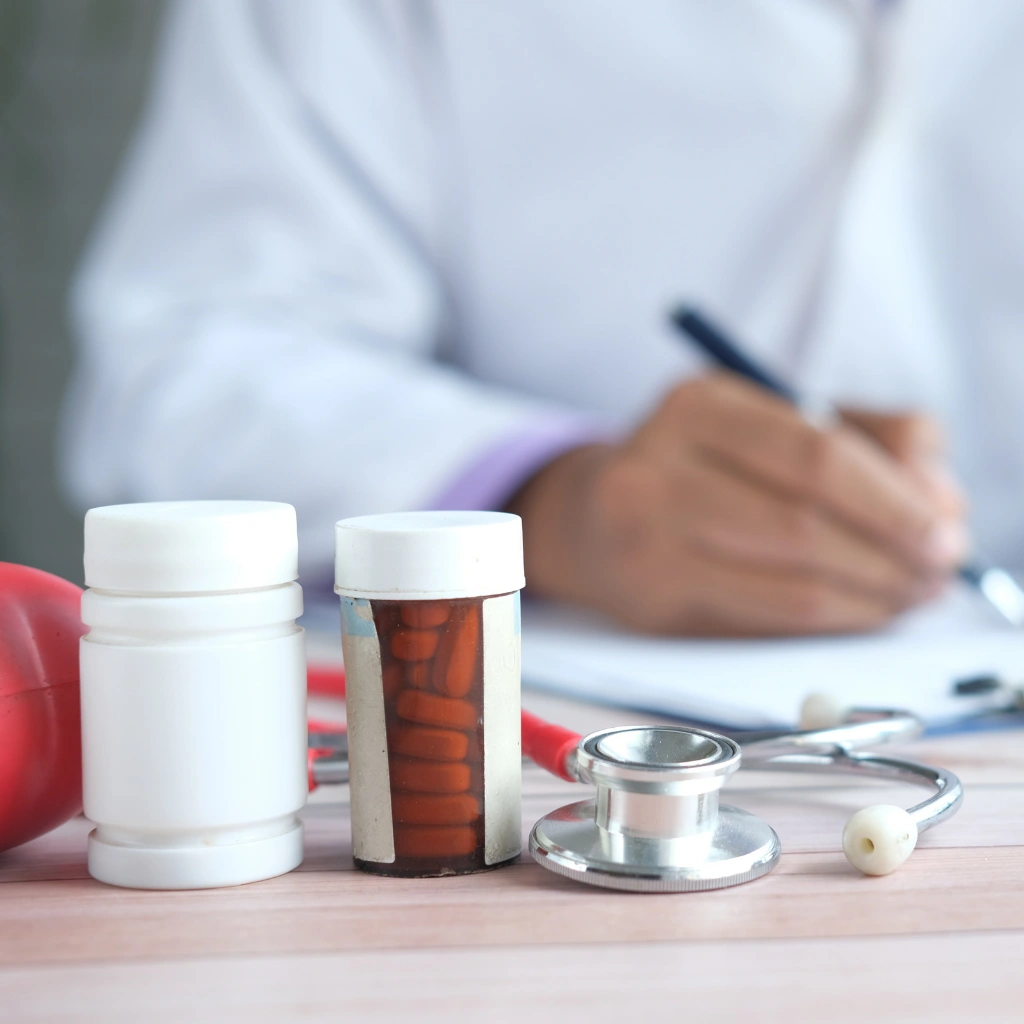 Nutraceutical professional writing notes with supplements