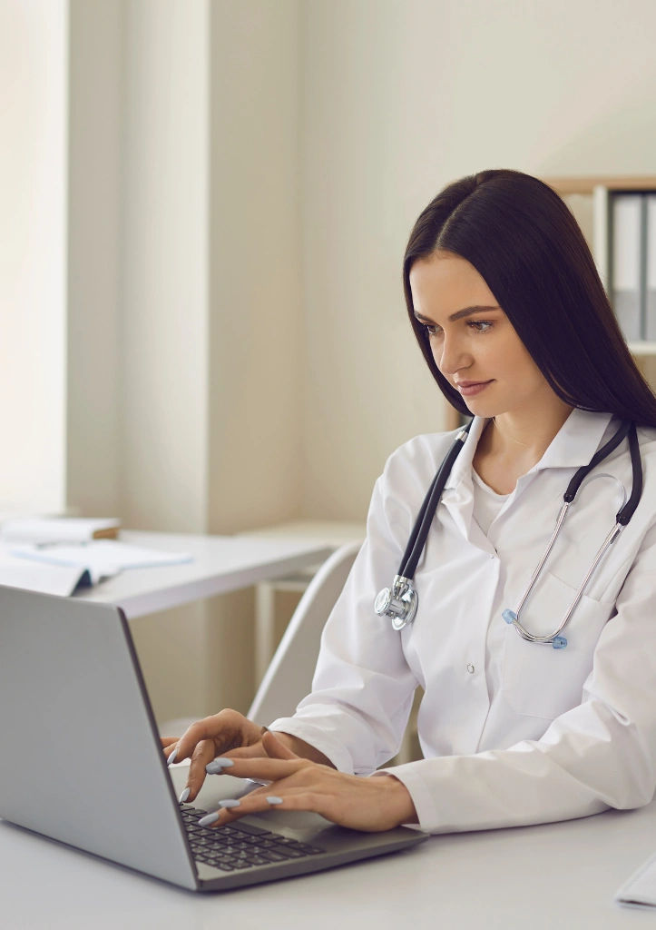 Medical researcher working on laptop