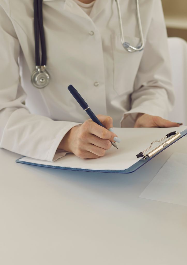 Doctor writing clinical manuscript notes