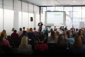 Audience attending academic research presentation