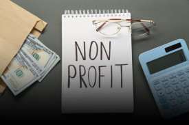 Non-profit notepad with financial documents and calculator