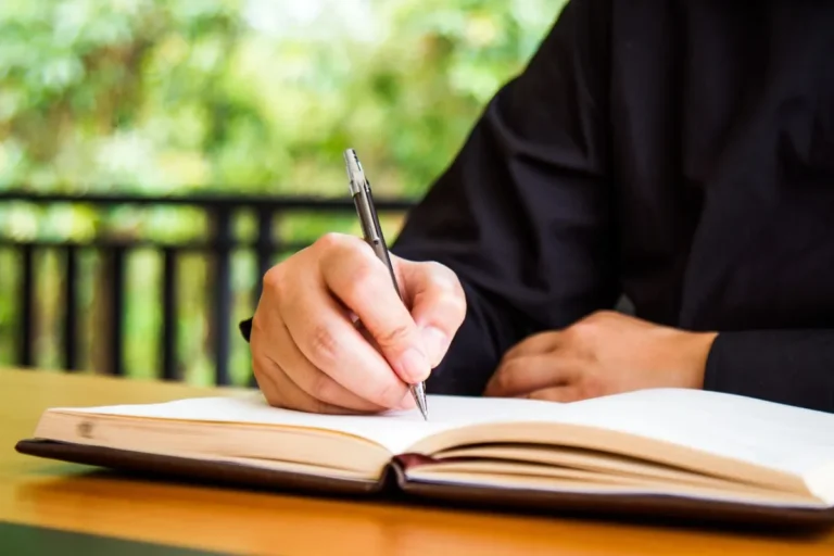 businessman-writing-book